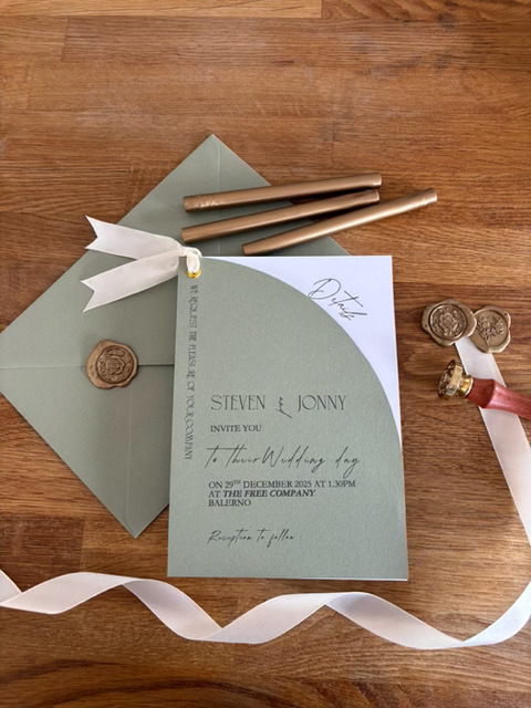 Sage green wedding invitation with wax seal